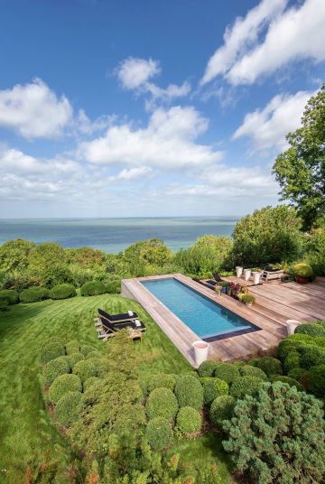 Spectacular. That's the word that comes to mind when looking at this image. The pool appears to flow into the sea and the clouds too seem eager to leave the earth to join the open ocean.