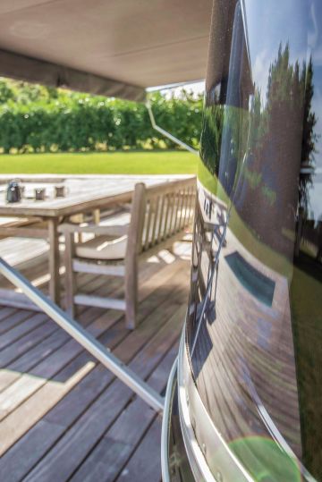 Reflected in the Airstream’s window, it's as if the square Piscinelle pool is the very essence of this unconventional pool area.