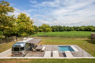 Two sides of the pool area are exquisitely bordered by the ipe deck, with a traditional dry-stone wall extending along the other two sides. As a whole, the space exudes precision and control, while also remaining very inviting.