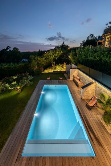 With the peaceful pool seemingly in dialogue with a majestic sky, this is the blue hour when the earth is in deep conversation with the heavens for a few minutes each day.