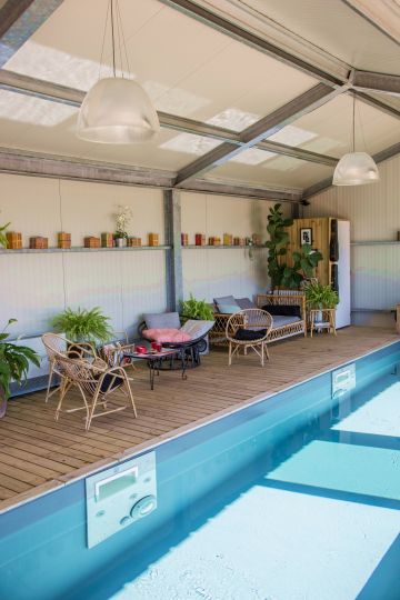 The pool room has a similar feel to the adjoining living room, with its simple, designer look, rattan furniture and cushions giving visitors the feeling of being far away.