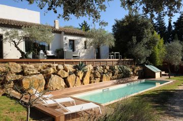 A lap pool with a wooden deck 