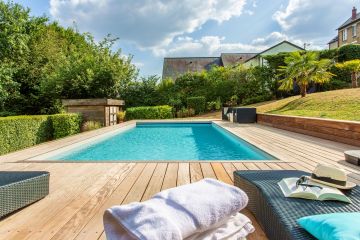 A minimalist pool in a landscaped garden.