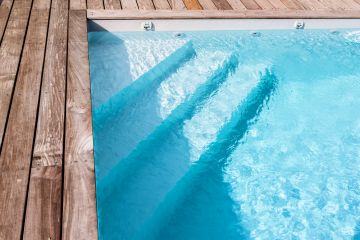 The pool is fitted with integrated corner steps beneath the liner, a bespoke feature added to all Piscinelle pools.