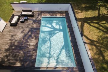Viewed from above, the crisp lines, clean composition and soft shades embody the spirit of this pared-down luxury pool.