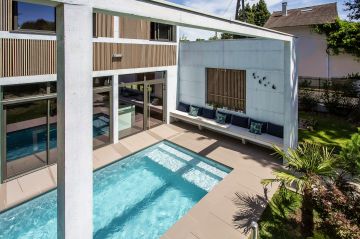 The submerged pool steps provide the perfect place to relax.