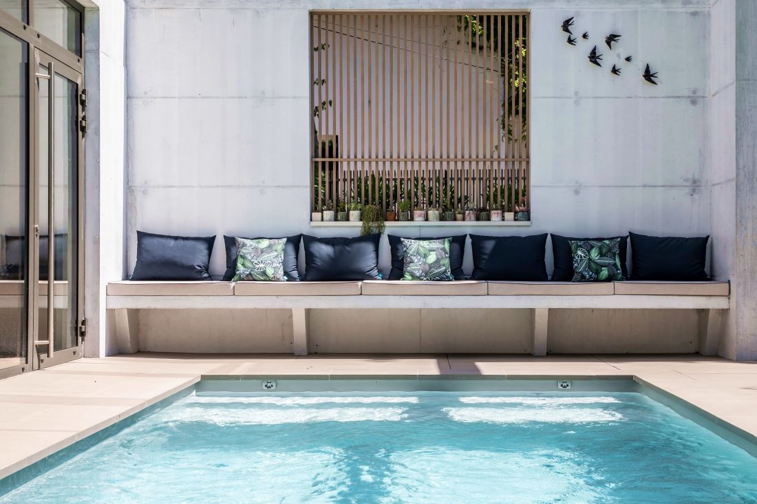 The pool area was designed before work began on the house, so it was possible to include very specific features like this bench incorporated into the building.