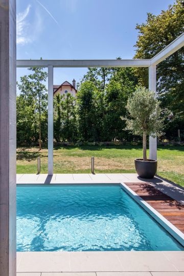 The pool, the little olive tree, the vast blue sky … the house suddenly becomes a daily escapist retreat.