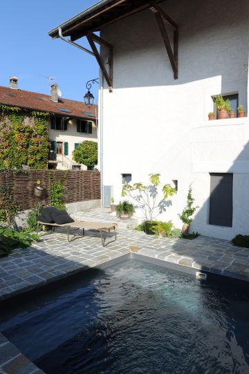 Piscinelle pool with stone patio